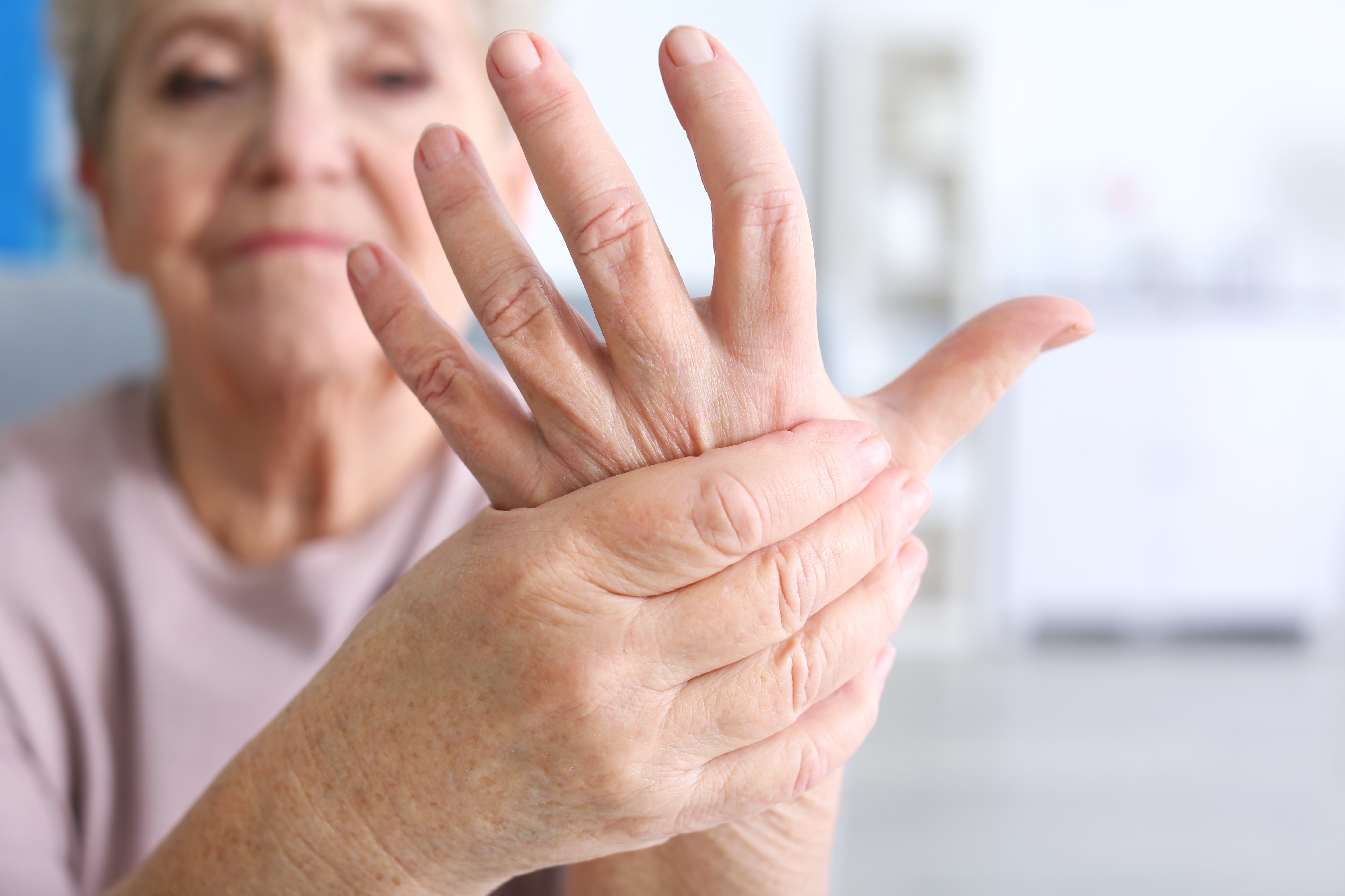 holding hand with arthritis